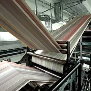 Paper passing through a web offset machine in an italian newspapers printing press. Other images in: